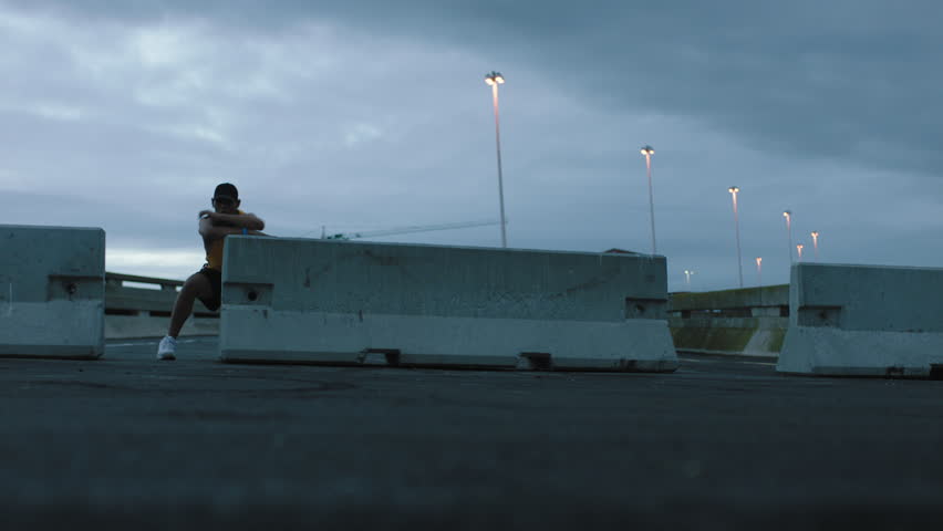 dancing man young break dancer performing modern hip hop dance moves practicing urban freestyle choreography in cloudy urban city