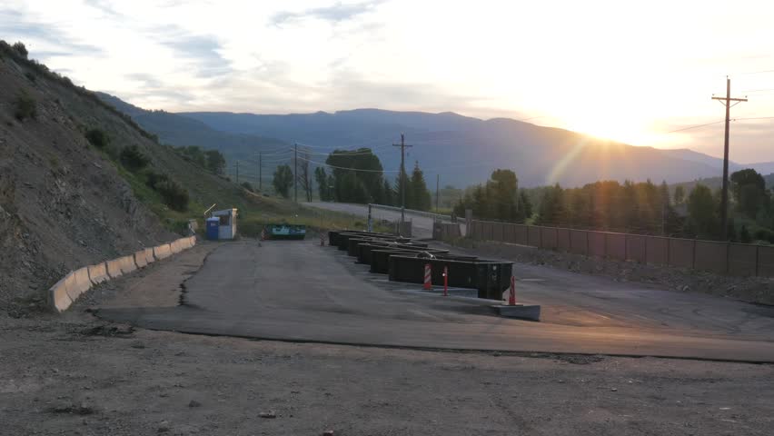 Clean lookin garbage transfer station in the early morning.