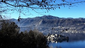 Footage of panoramic e beautiful view of the Lago e Isola Orta San Giulia in autumn. Italy