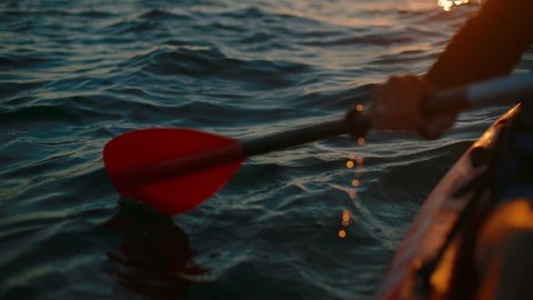 Close-up of a paddle boat at dawn. in slow motion