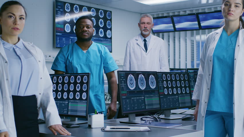 Diverse Team of Medical Scientist Posing with Crossed Arms in the High-Tech Laboratory. Brain Sceince / Neurology Center Research Lab. Shot on RED EPIC-W 8K Helium Cinema Camera.