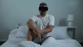 Male installs and updates software in modern vr headset, smart house technology