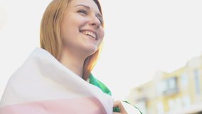 Smiling Italian girl standing in street with national flag, patriotic feelings - Powered by Shutterstock - Get 15% off with code: PIKWIZARD15