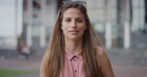 Portrait of attractive young woman smiling, enjoying successful lifestyle
