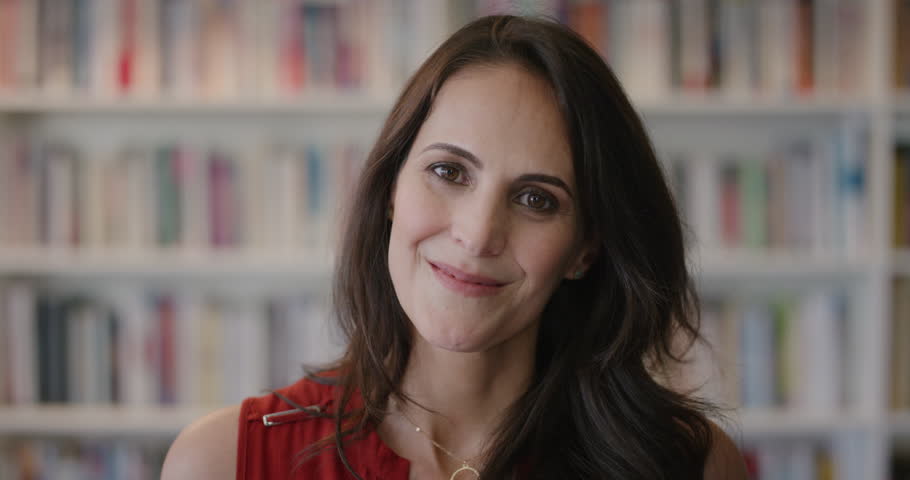 close up portrait stylish mature business woman laughing enjoying successful business lifestyle in bookstore library background slow motion