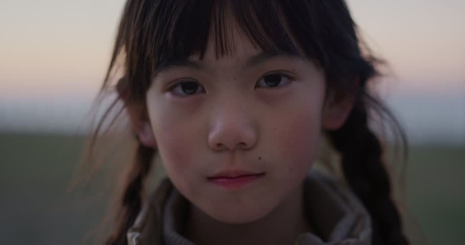 close up portrait of cute asian girl smiling cheerful enjoying happy summer vacation on seaside park slow motion