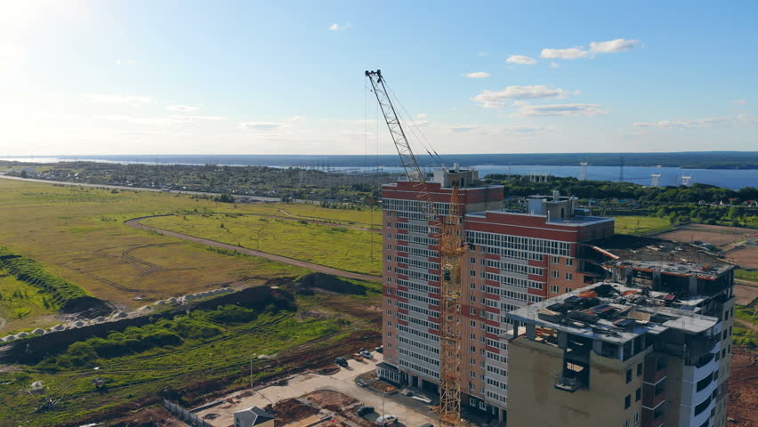 Construction site on a green field.
