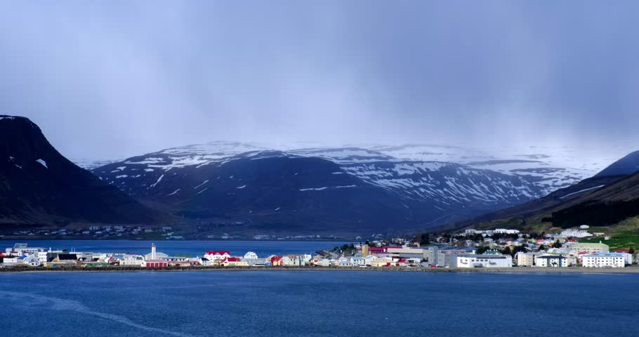 Aerial view of Isafjordur city from cruise ship in Northern Iceland with snow capped mountains in the background