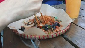 Fried Flat Noodles On wooden Table Inside Restaurant