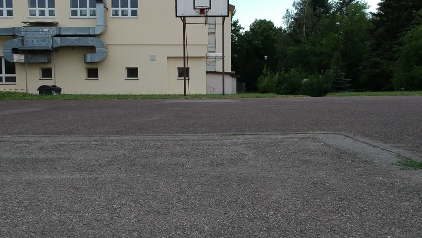 Abadonded playground with few basketball hoops.