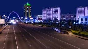 Automobile traffic across the main road. Cityscape 4K TimeLapse at night. Central Asia, Kazakhstan, Astana  - JUNE, 2018. 