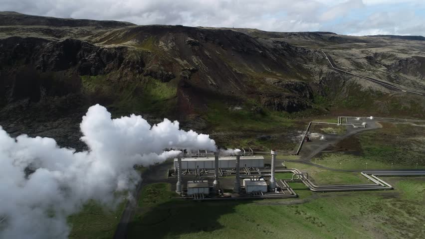 Aerial footage of a clean energy power plant in Iceland producing heat and electricity with geothermal power