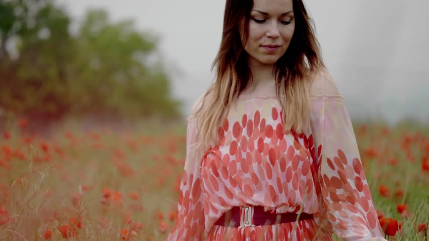 Beautiful young in the poppy field