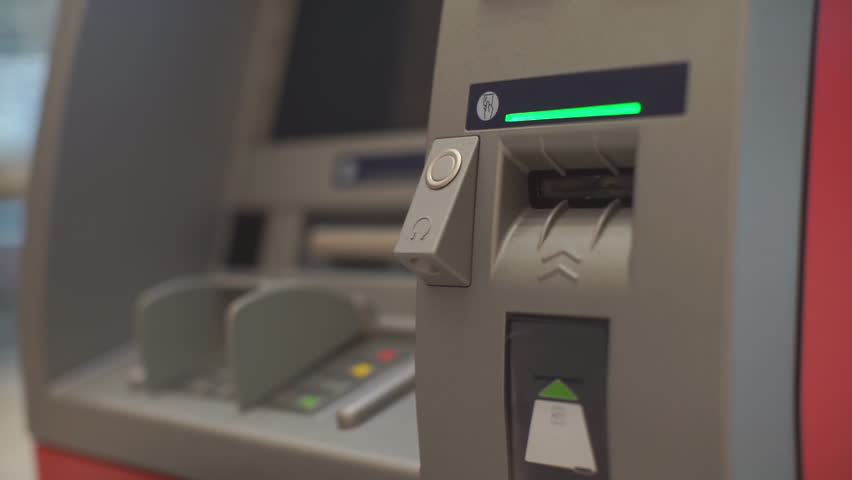 Credit card entry to ATM hand uses bank card. Getting cash in a safe way. Financial security and banking system concept. Operation with electronic money. Withdraw cash and make deposits. Closeup. | Shutterstock HD Video #1013160926