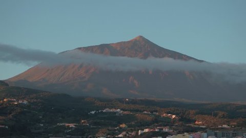 Teide volcano in Tenerfie, aerial drone view from the North coast with the small houses in the foreground. Little town with the view of the vulcan. 