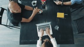 Top view - desktop of a creative business team that works on laptops and communicates using smartphones in office. Coworking - Powered by Shutterstock - Get 15% off with code: PIKWIZARD15