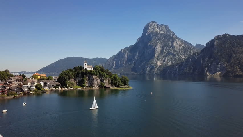 Flight over Traunkirchen church on Traunsee lake, in Salzkammergut, Upper Austria.