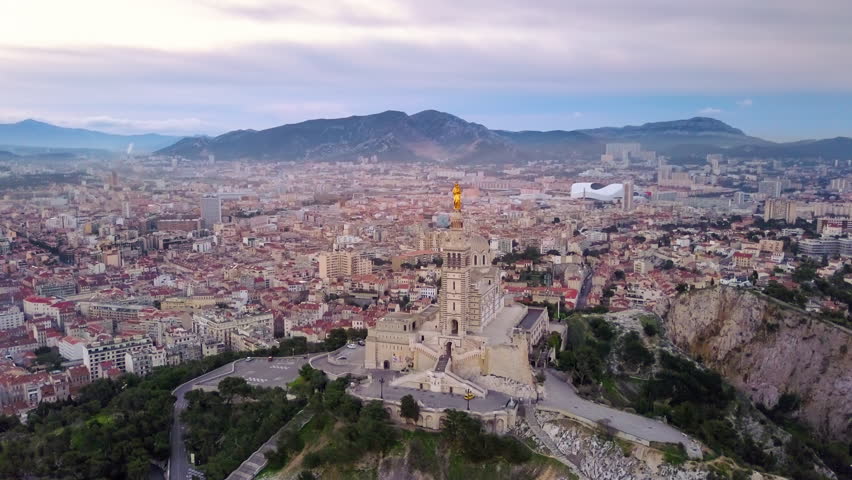 marseille basilica notre dame de la garde aerial shot at sunrise flight around