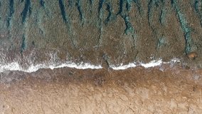 Waves crashing, waves braking on a reef, tropical sea, drone, bird's eye view, top