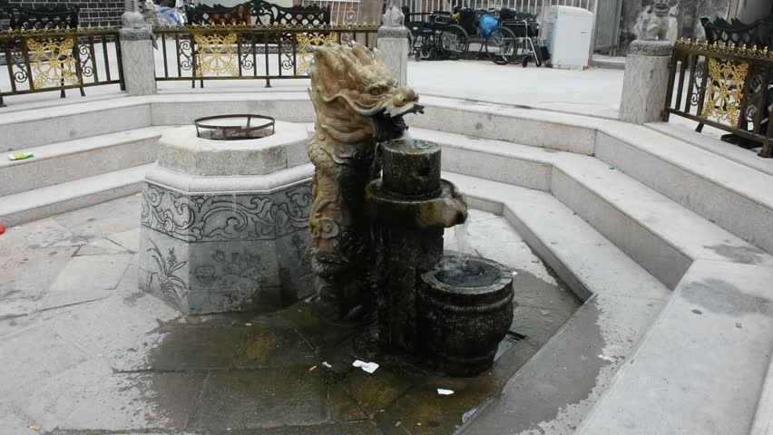 Sculpture dragon stone fountain in garden at outdoor in Shantou city or Swatow city of Guangdong, China