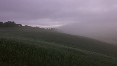 Tuscany panorama landscape at dawn with farm house and hills, Italy, 4k