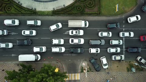 Summer 2018 aerial drone footage of rooftops and streets in the center of Krasnodar city, Russia. Top down view of traffic jam.