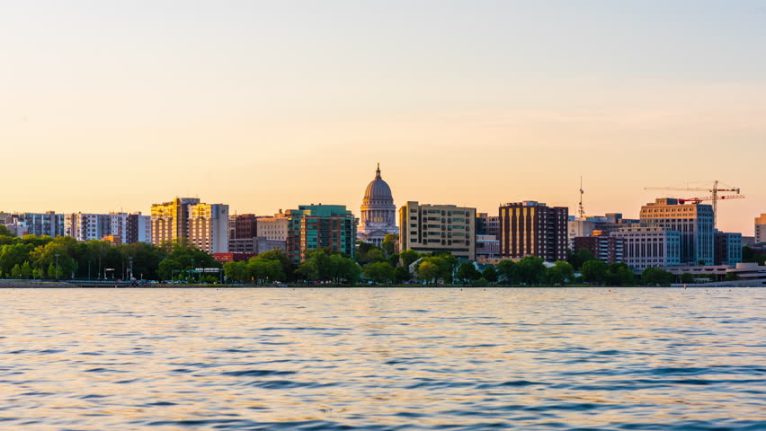 Madison, Wisconsin, USA downtown skyline at dusk on Lake Monona.