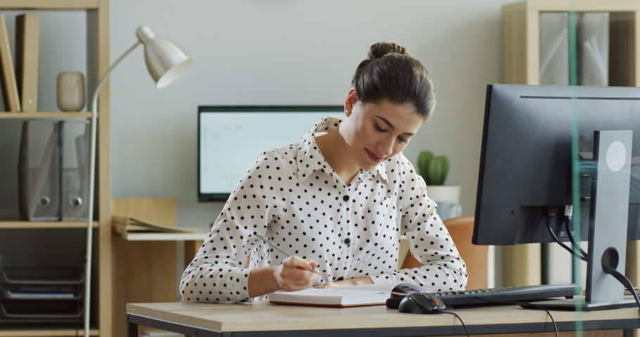 Caucasian pretty female office worker crossing out tasks in her notebook before going home, then her boss bringing a lot of new work on her table and she tossing sheets of documents in the air. At