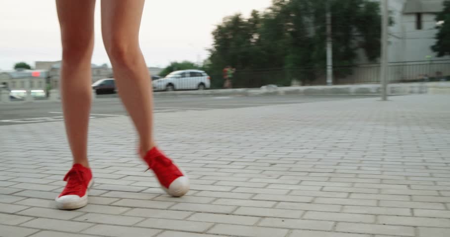 Ladylike candid with nice legs walking in the street