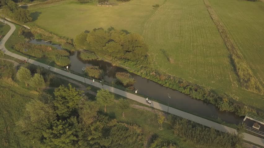 drone footage , walking people outside the city.