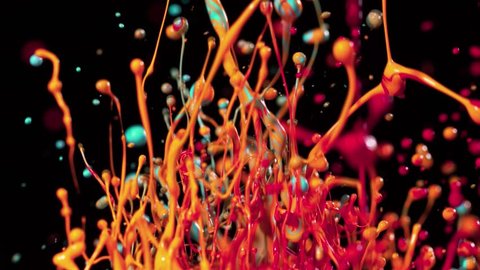 Colorful splashing paint in super slow motion. Shot with high speed cinema camera, 1000fps