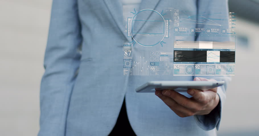 Close up of the female hands pointing on the commerce hologram which works from a tablet device. Outside