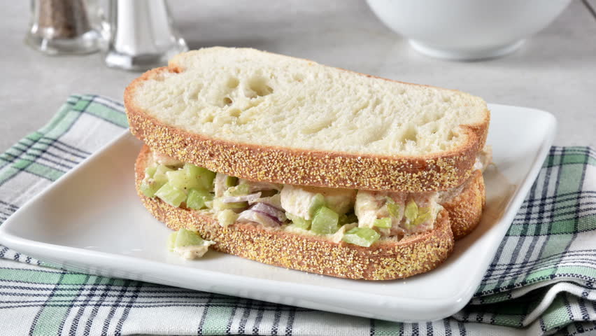 Chicken salad sandwich on a plate close up
