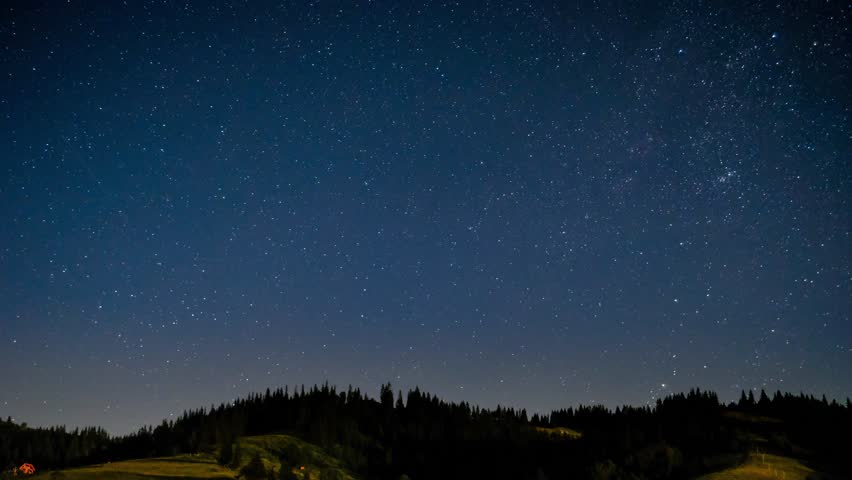 Night sky time lapse of stars over mountains hills, Smoky mountains, USA