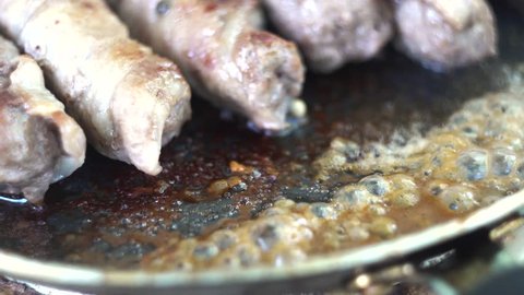 Preparation of meat dish from minced meat wrapped in bacon with white veins. Clous-up