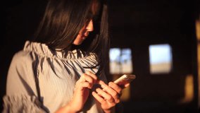 Young woman sitting using smartphone in coffee cafe, urban women lifestyle technology, vintage style chat using smartphone outdoors the video photo for social media. girl brunette lifestyle slow