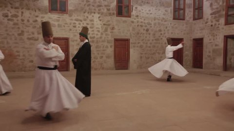 Sufi whirling dervish (Semazen) dances at Tokat. Semazen conveys God's spiritual gift to those are witnessing ritual. He spins with the music. Mevlana Celaleddin Rumi, Mevlevi. Tokat,Turkey 19.09.2013