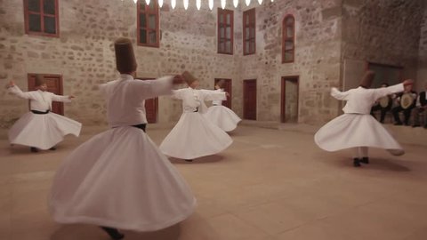 Sufi whirling dervish (Semazen) dances at Tokat. Semazen conveys God's spiritual gift to those are witnessing ritual. He spins with the music. Mevlana Celaleddin Rumi, Mevlevi. Tokat,Turkey 19.09.2013