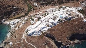 Aerial drone bird's eye view video from picturesque citadel and village of Kastro overlooking the Aegean, island of Sifnos, Cyclades, Greece