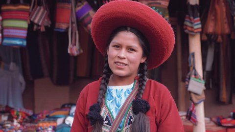 Portrait of Cute Peruvian girl smiling in slow motion