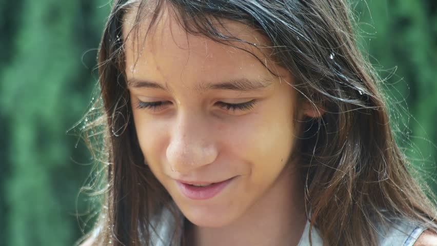 dissatisfied wet girl teenager standing in pouring rain. 4k