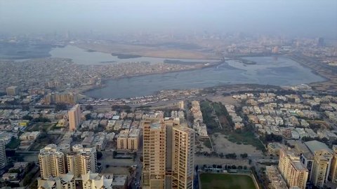 360 degree pan aerial view of the Karachi city near sea port and beach