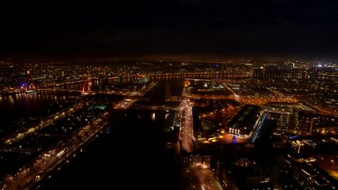 Timelapse video of Rotterdam at night with rushing traffic, ships, the river Maas and all the city lights