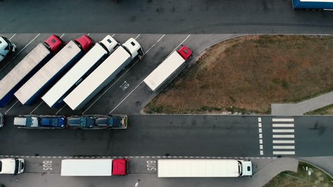 trucks in the parking lot, shot from the drone in 4k
