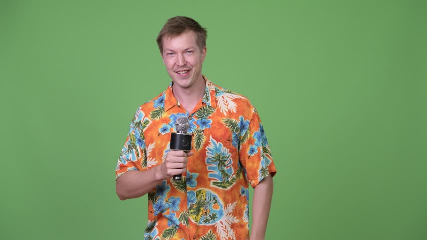 Young handsome tourist man introducing young handsome African man
