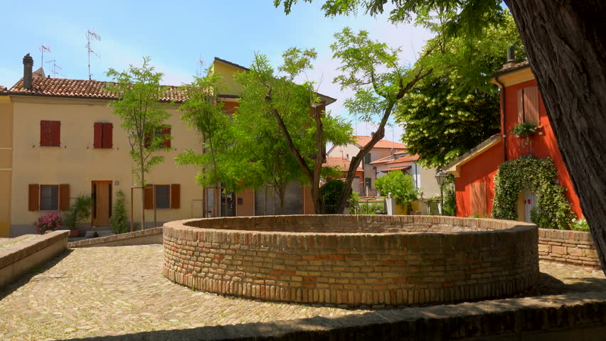 square of colorful houses with cone-shaped holes made of bricks dug in the ground for the ancient preservation of fishing and foodstuffs