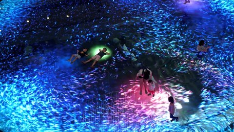 Singapore, 26 May 2018. Large screen augmented reality experience on the floor. Digital Light Canvas at Marina Bay Sands Science, people with their children have fun at it screen. 3840x2160, 4k