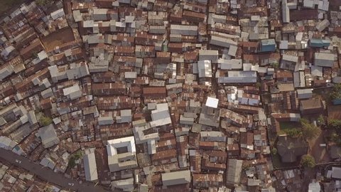 KIBERA, NAIROBI, KENYA, AFRICA - CIRCA 2017 - Aerial shot looking straight down above vast overpopulated slums in Kibera, Nairobi, Kenya, Africa.