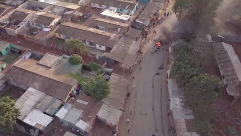 NAIROBI, KENYA - CIRCA 2017 - Aerial over rioting, fires and riots in the Kibera slum of Nairobi during controversial elections in Kenya in 2018.