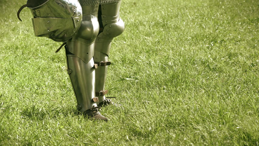 Armored legs of medieval warrior